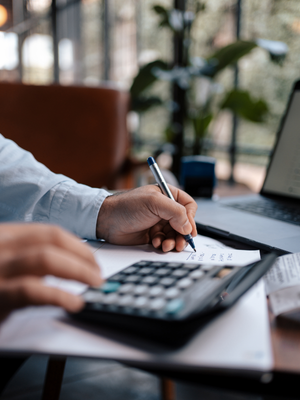 man working with a calculator